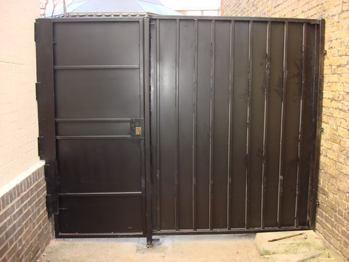This is an external Bar Grille Gate, steel sheeted for privacy and security.