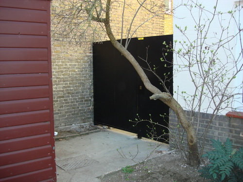 Wrought iron side gate with door